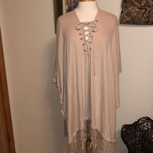 Tan oatmeal poncho with crisscross closure